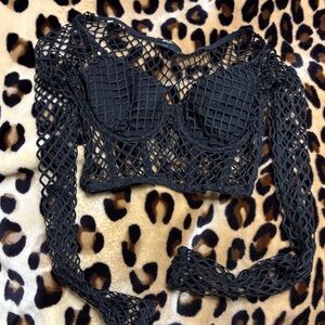 Black Fishnet Long Sleeve Crop Top with padded bra. Nasty Gal